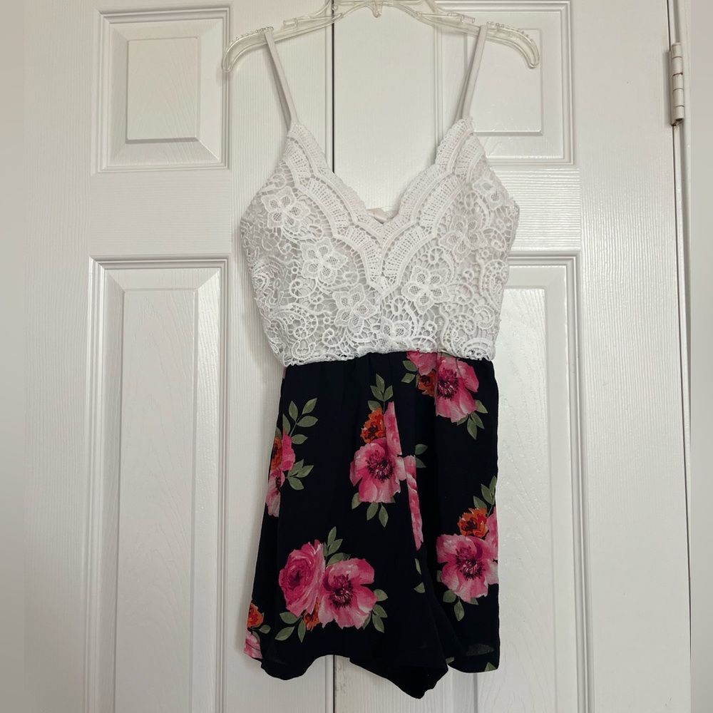 Chic White and Black Romper with Vibrant Floral Accents